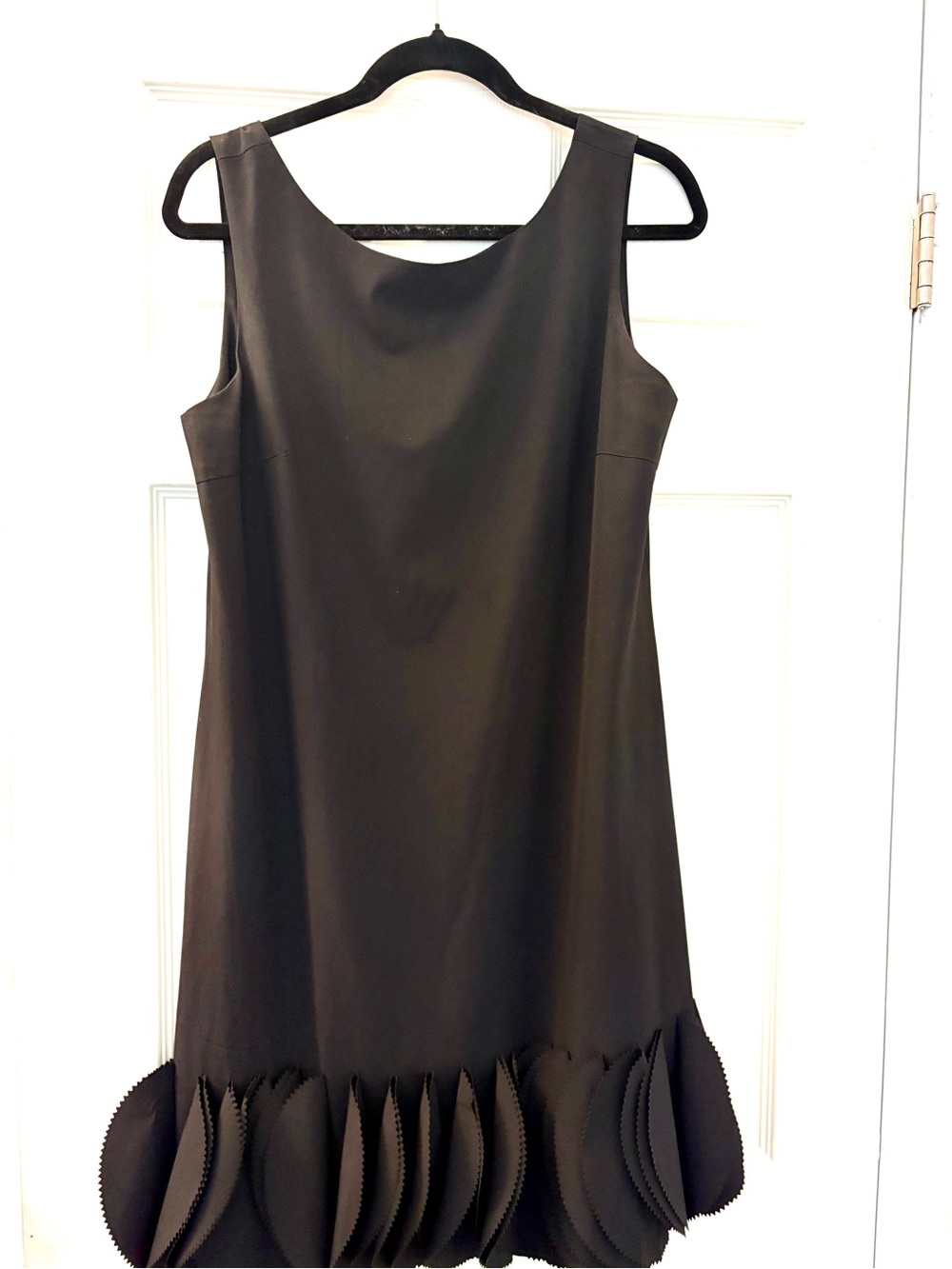 Kling Black Sleeveless Mini Dress with Sculpted Hem Accents